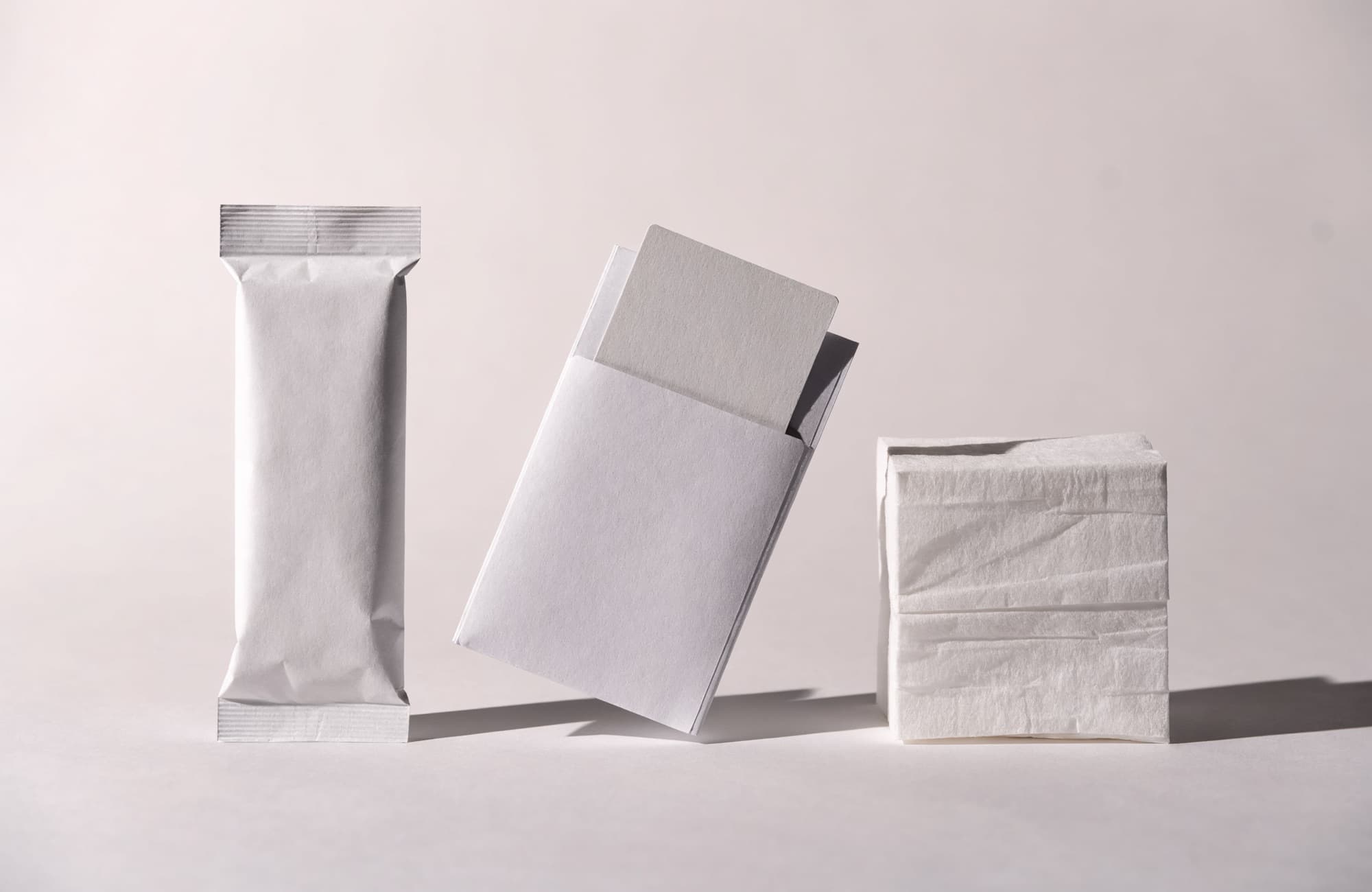 Paper toothbrush pouch, key card holder sleeve, and folded facial tissues